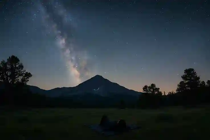 Stargazing in Great Basin National Park with the Milky Way stretching above Wheeler Peak and bristlecone pines silhouetted against the night sky.